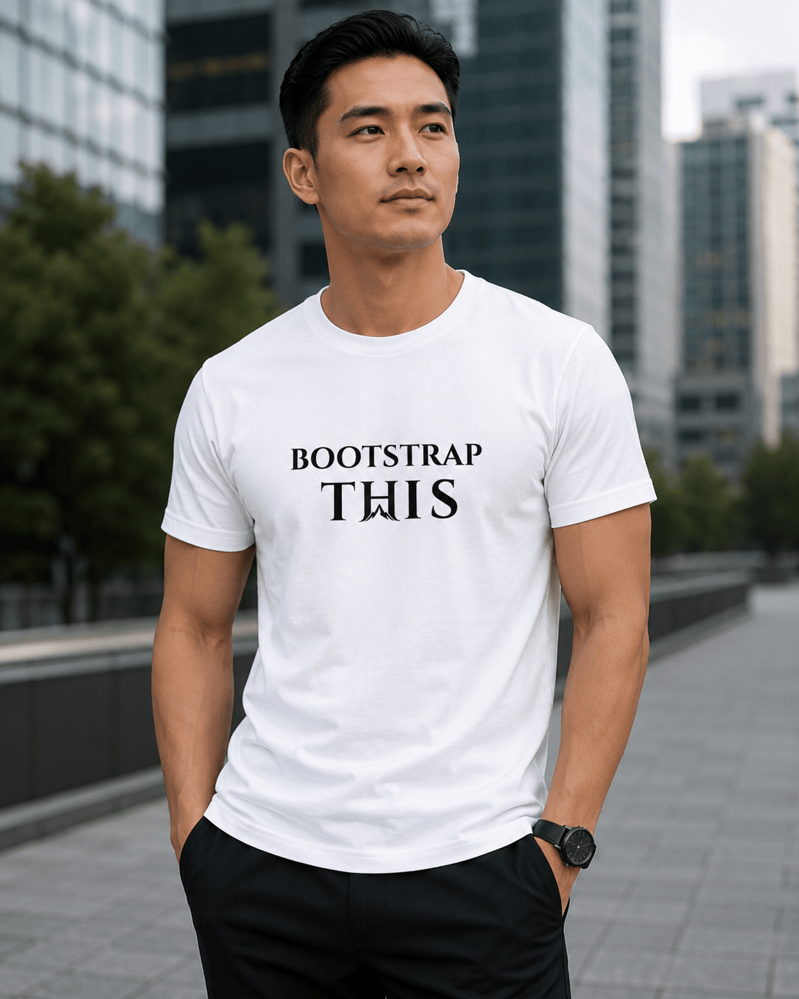 Bootstrap This Men's Tee — Black Edition, model wearing the White tee by an urban wall.