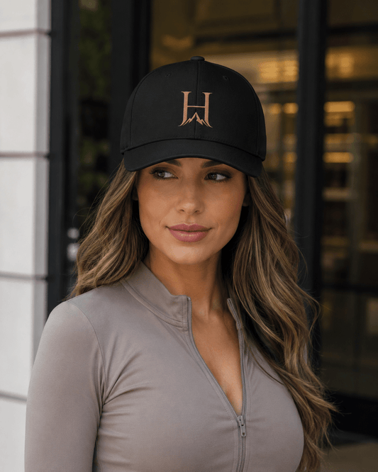 Distinction Flexfit Cap, model wearing the Multicam Black cap outdoors.