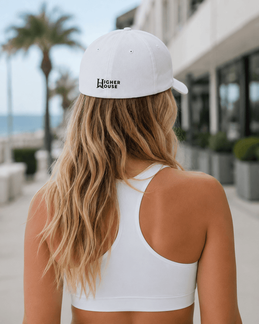 Heritage Flexfit Cap, model wearing the White cap outdoors.
