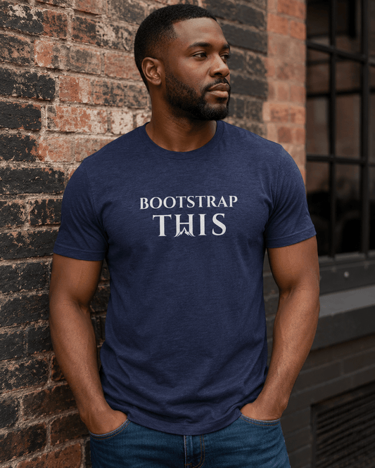 Bootstrap This Men's Tee — White Edition, model wearing the Heather Midnight Navy tee at a mountain overlook.
