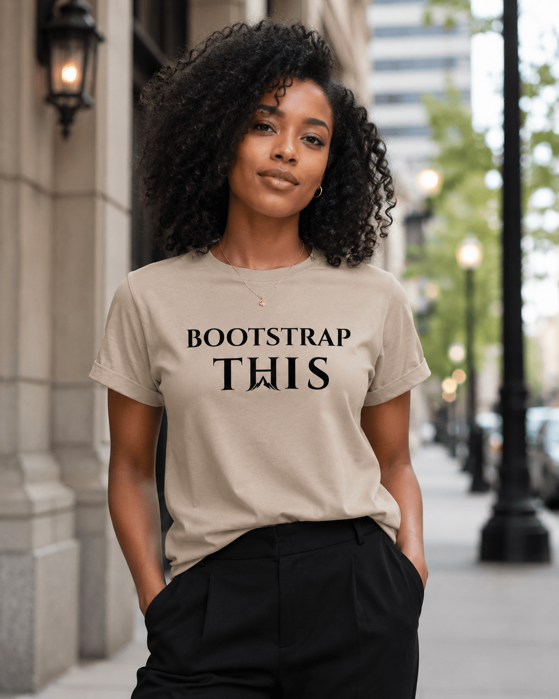 Bootstrap This Women's Relaxed Tee, model wearing the White relaxed tee outdoors.
