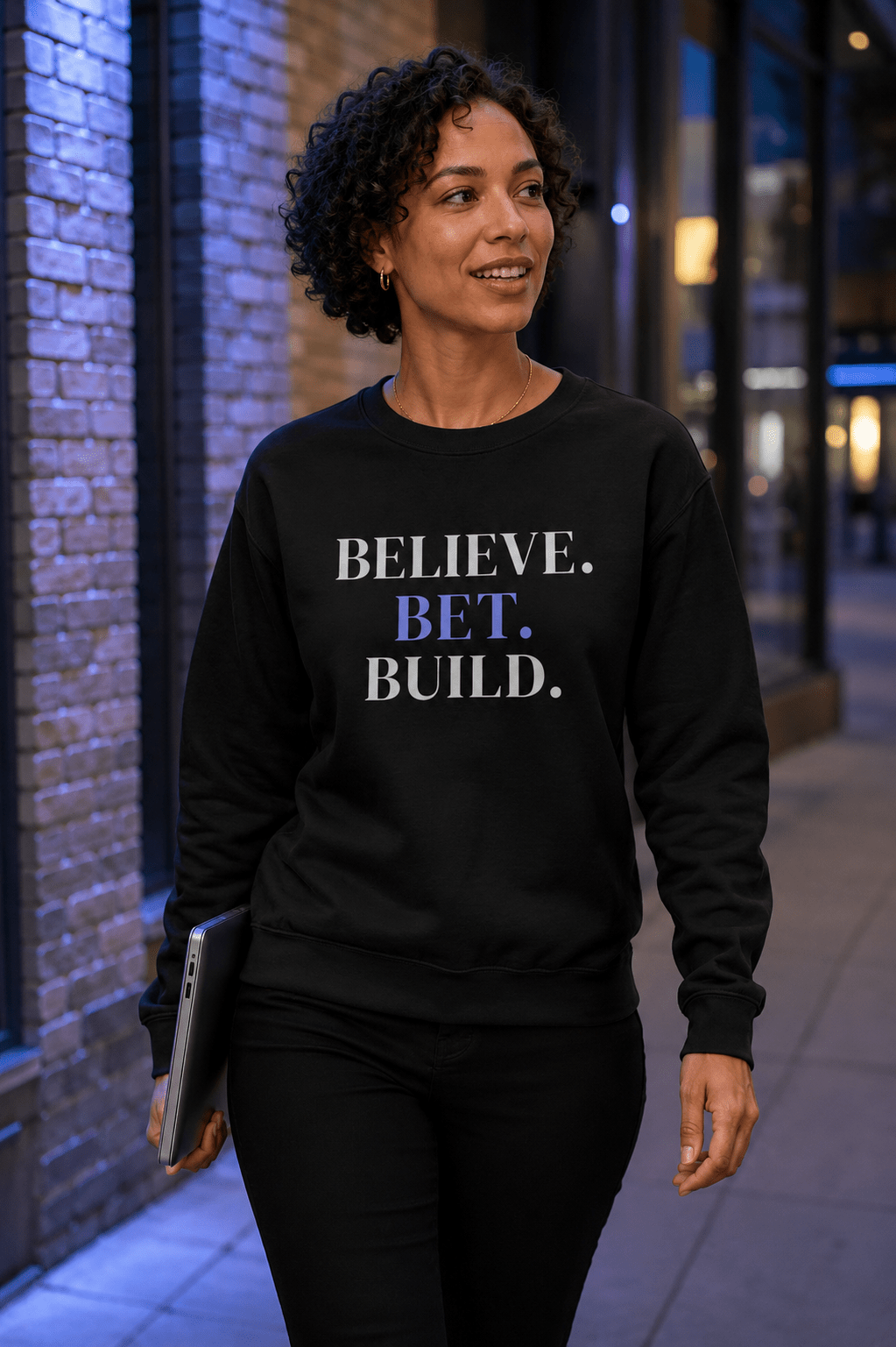 Black Bootstrappin’ BELIEVE. BET. BUILD. crewneck — model outdoors