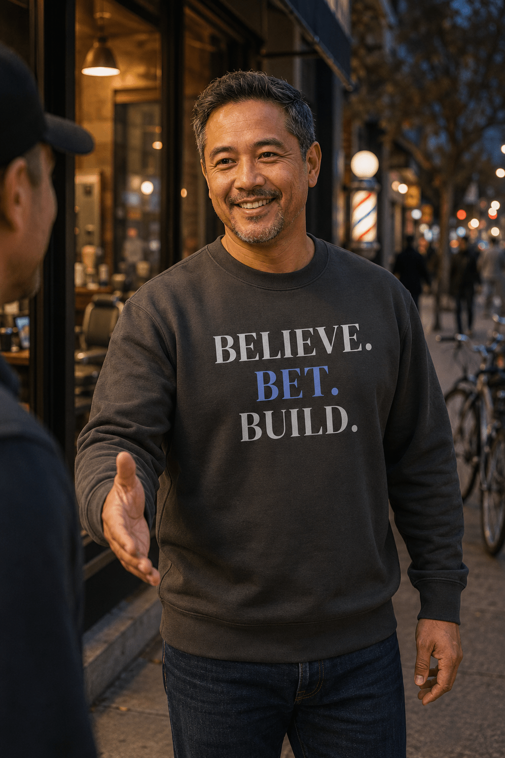 Vintage Black Bootstrappin’ BELIEVE. BET. BUILD. crewneck — model outdoors