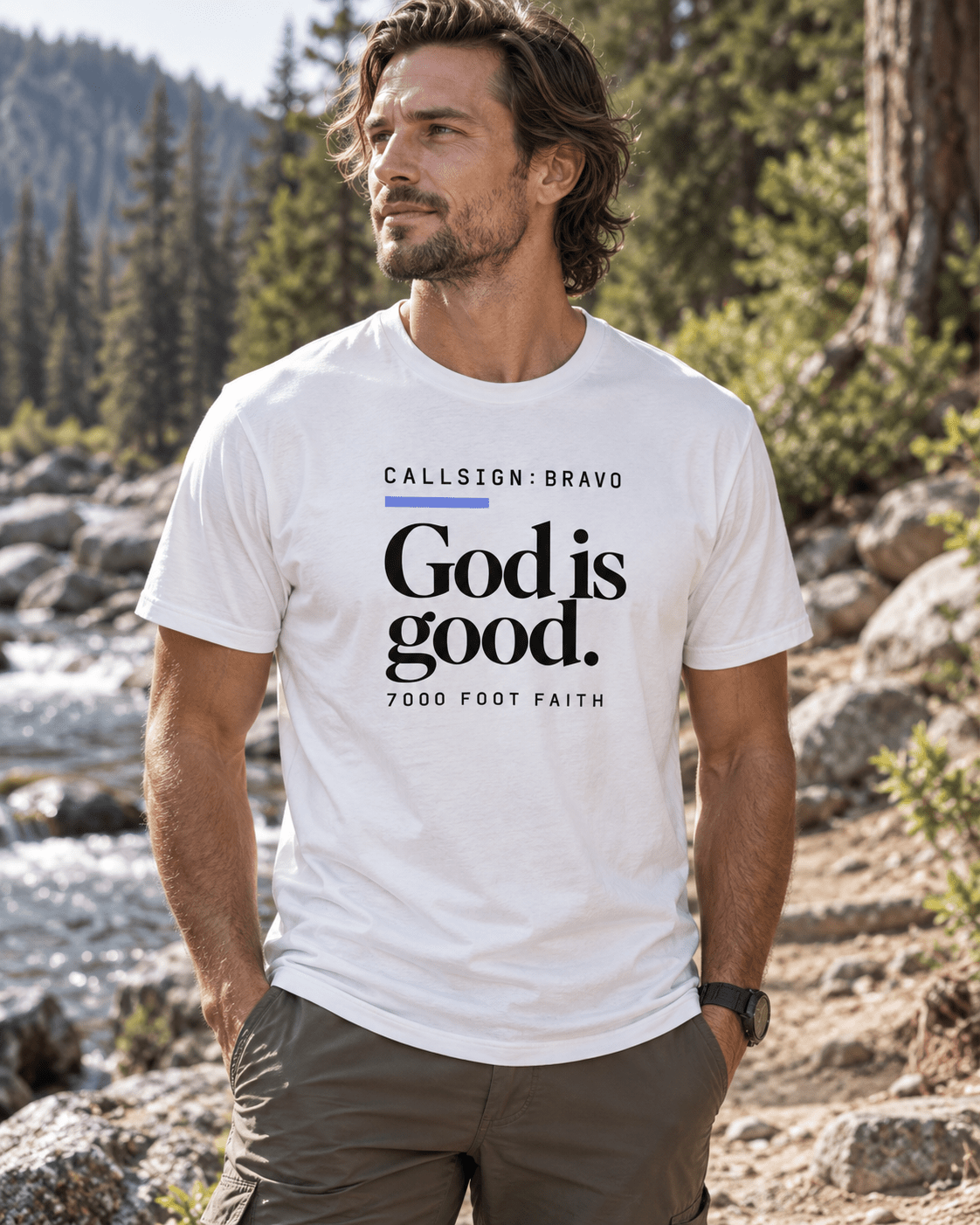 Solid White Blend God Is Good CALLSIGN: BRAVO tee — male model in the mountains