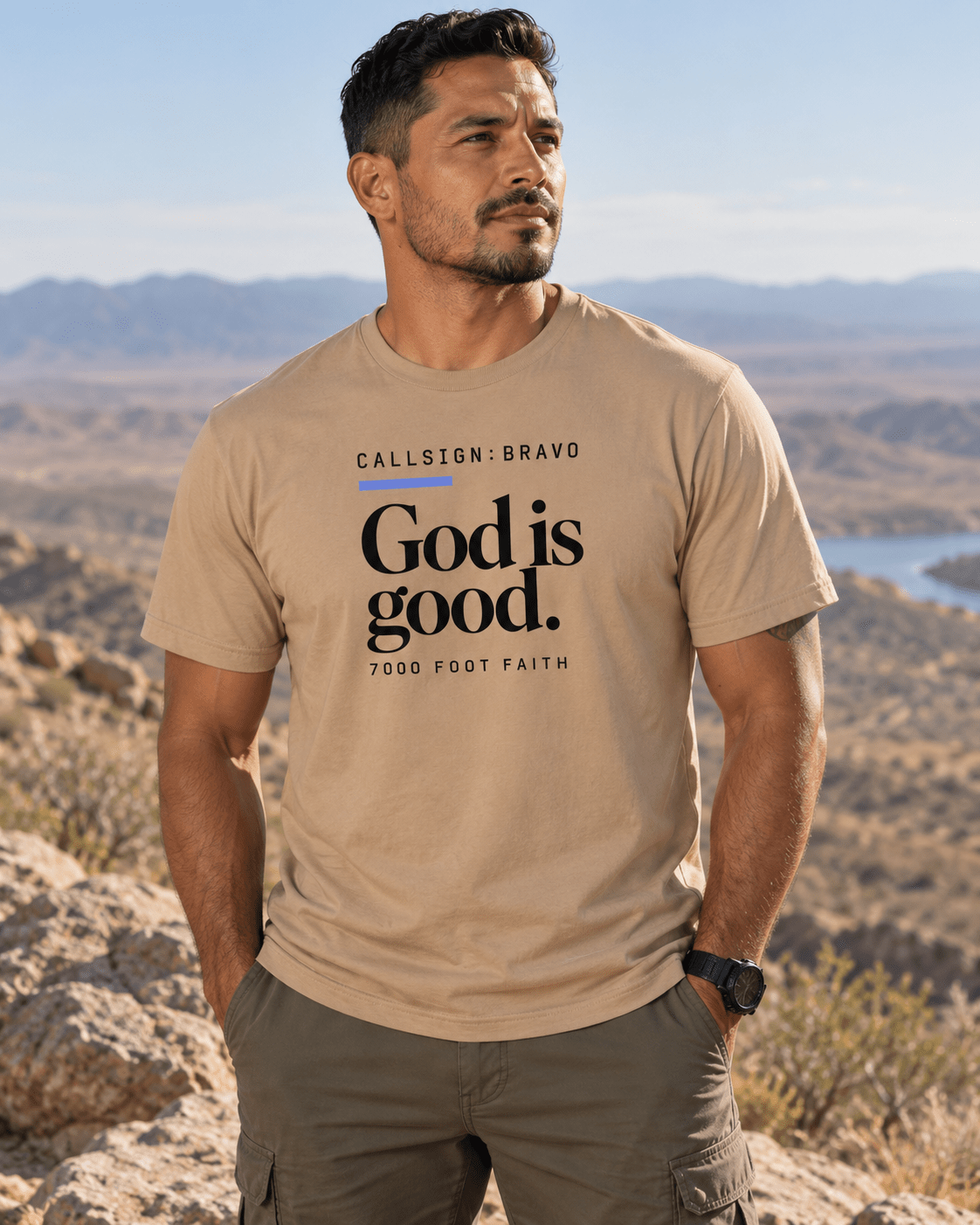 Tan God Is Good CALLSIGN: BRAVO tee — male model in the mountains