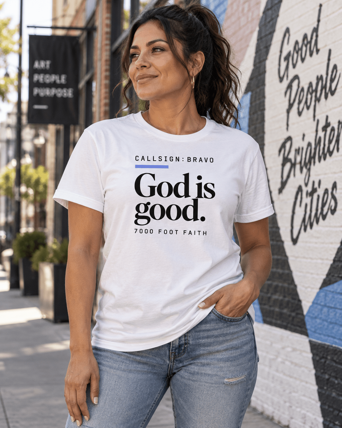 Solid White Blend God Is Good CALLSIGN: BRAVO tee — female model outdoors