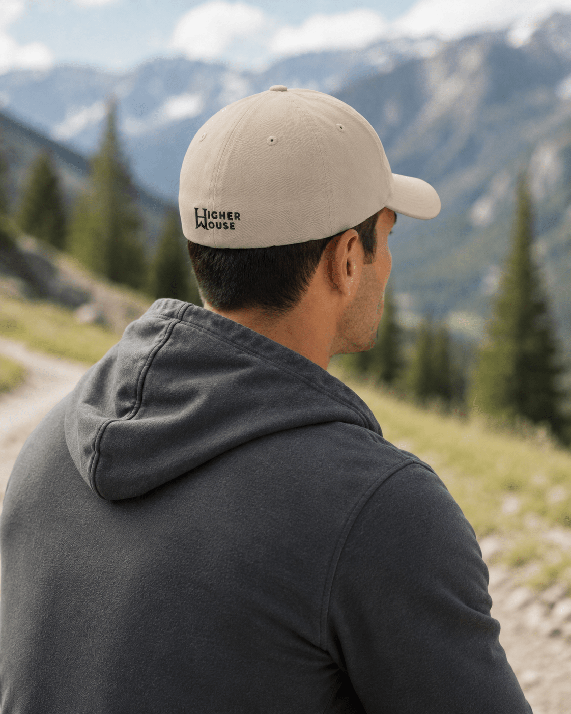 Heritage Flexfit Cap, model wearing the Khaki cap at a mountain overlook.