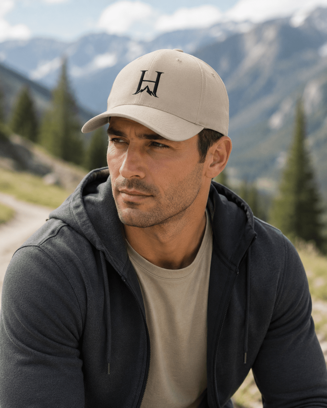 Heritage Flexfit Cap, model wearing the Khaki cap at a mountain overlook.