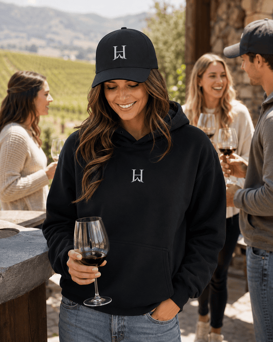 Notorious Flexfit Cap, model wearing the dark cap at an outdoor gathering.
