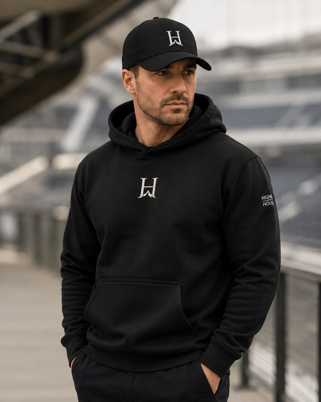 Notorious Flexfit Cap, model wearing the dark cap at an overlook.