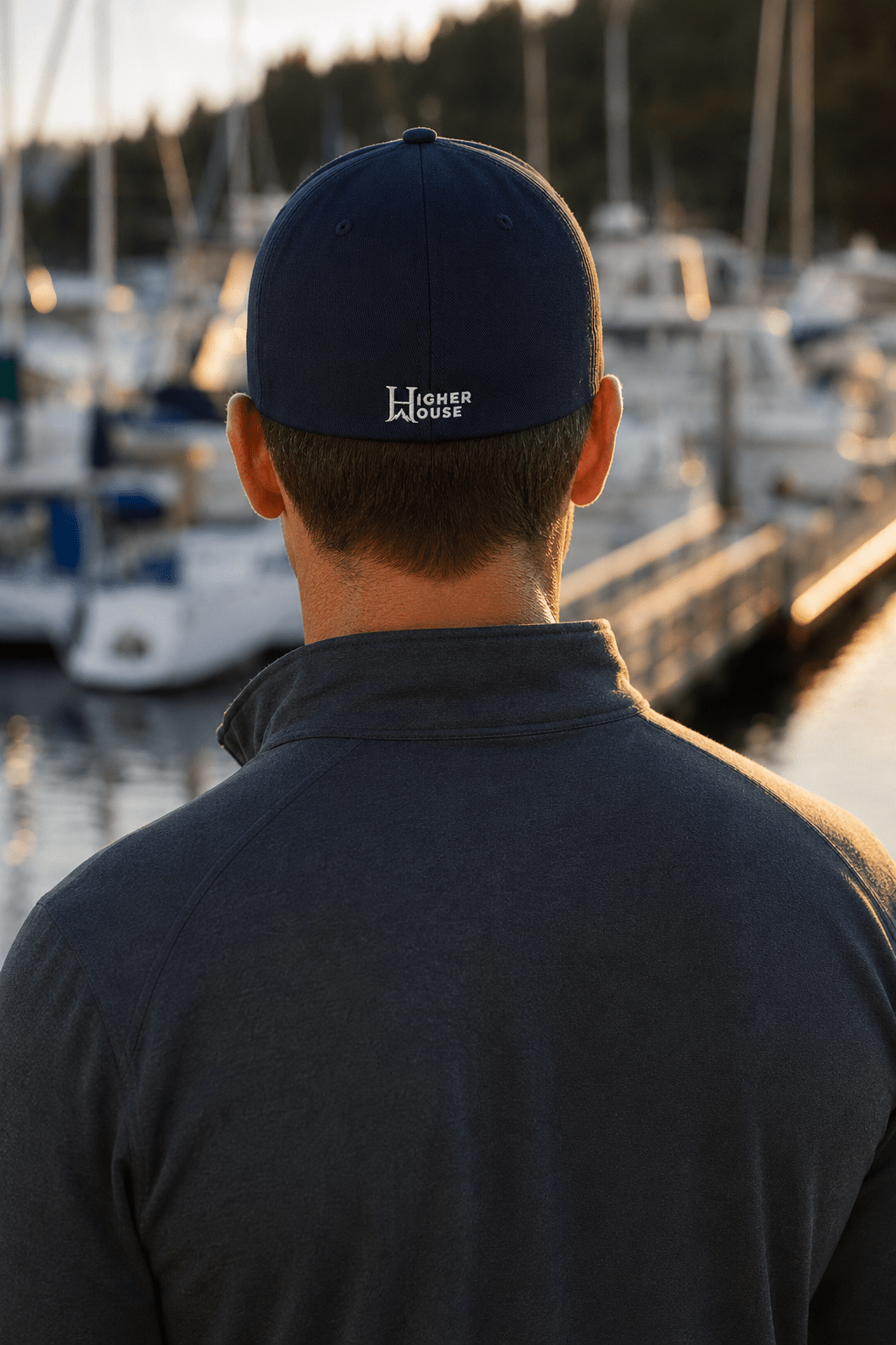Notorious Flexfit Cap, model wearing the dark cap outdoors.