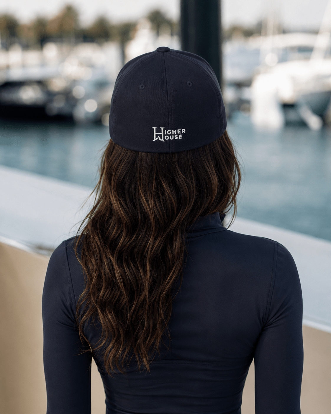 Notorious Flexfit Cap, model wearing the dark cap in the city.