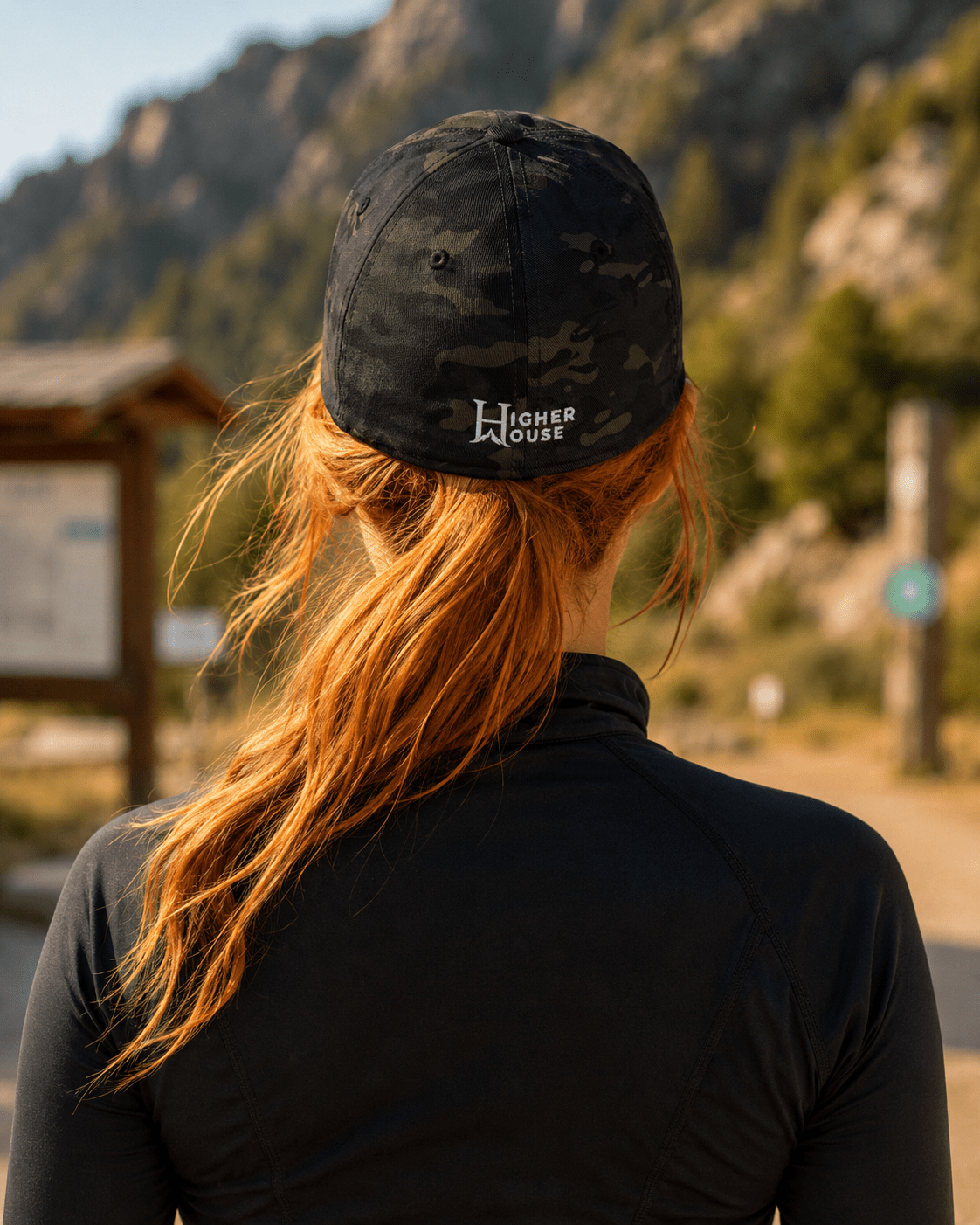 Notorious Flexfit Cap, model wearing the dark cap outdoors.