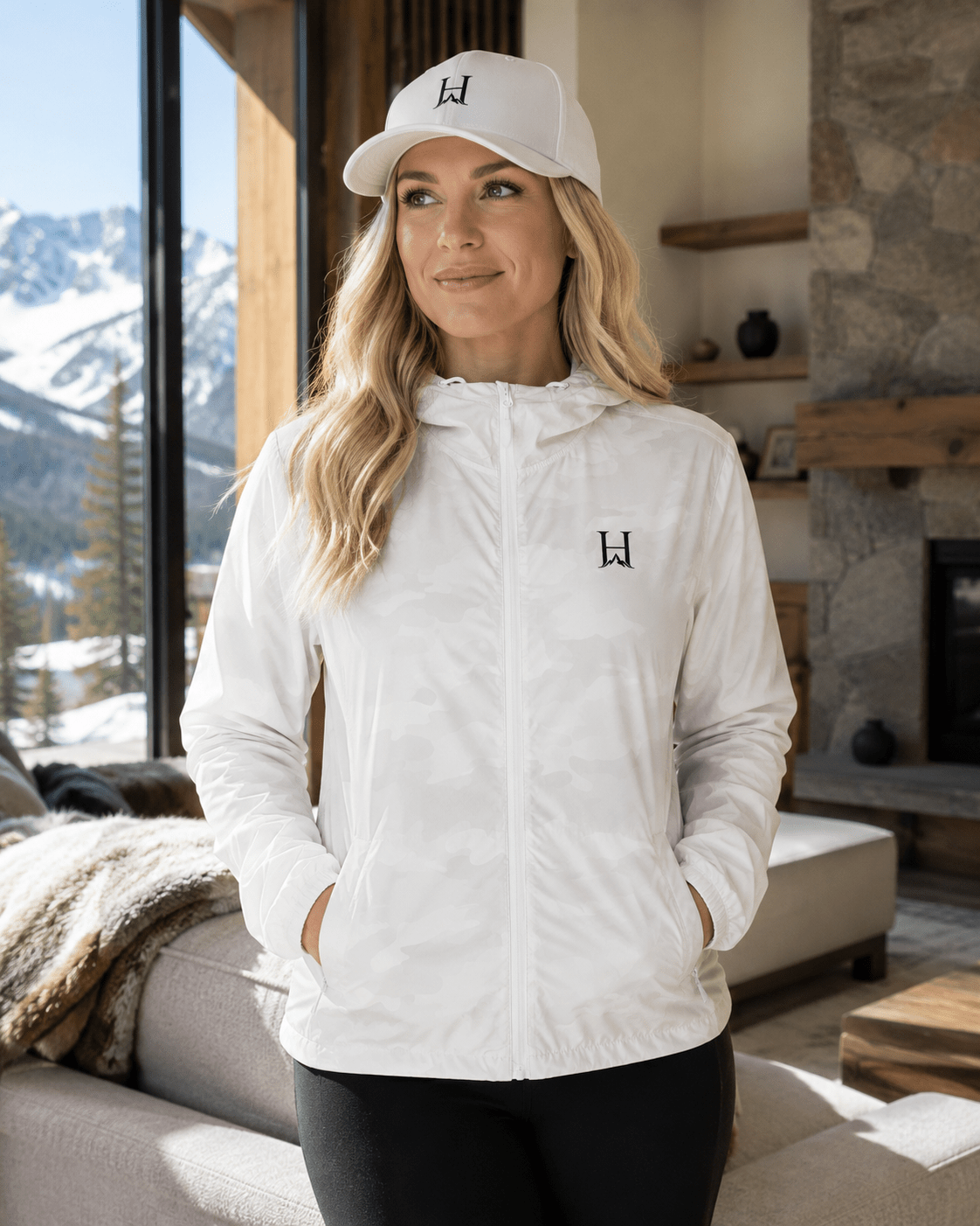 Heritage Flexfit Cap, model wearing the White cap with the Outlier windbreaker indoors.