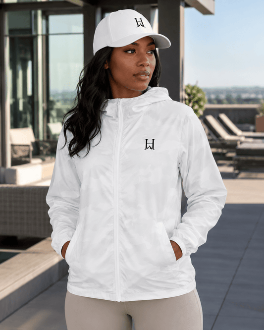 Heritage Flexfit Cap, model wearing the White cap with the Outlier windbreaker.