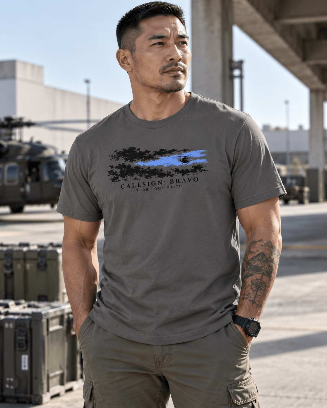 Asphalt The Opening CALLSIGN: BRAVO tee — male model near a hangar, front view
