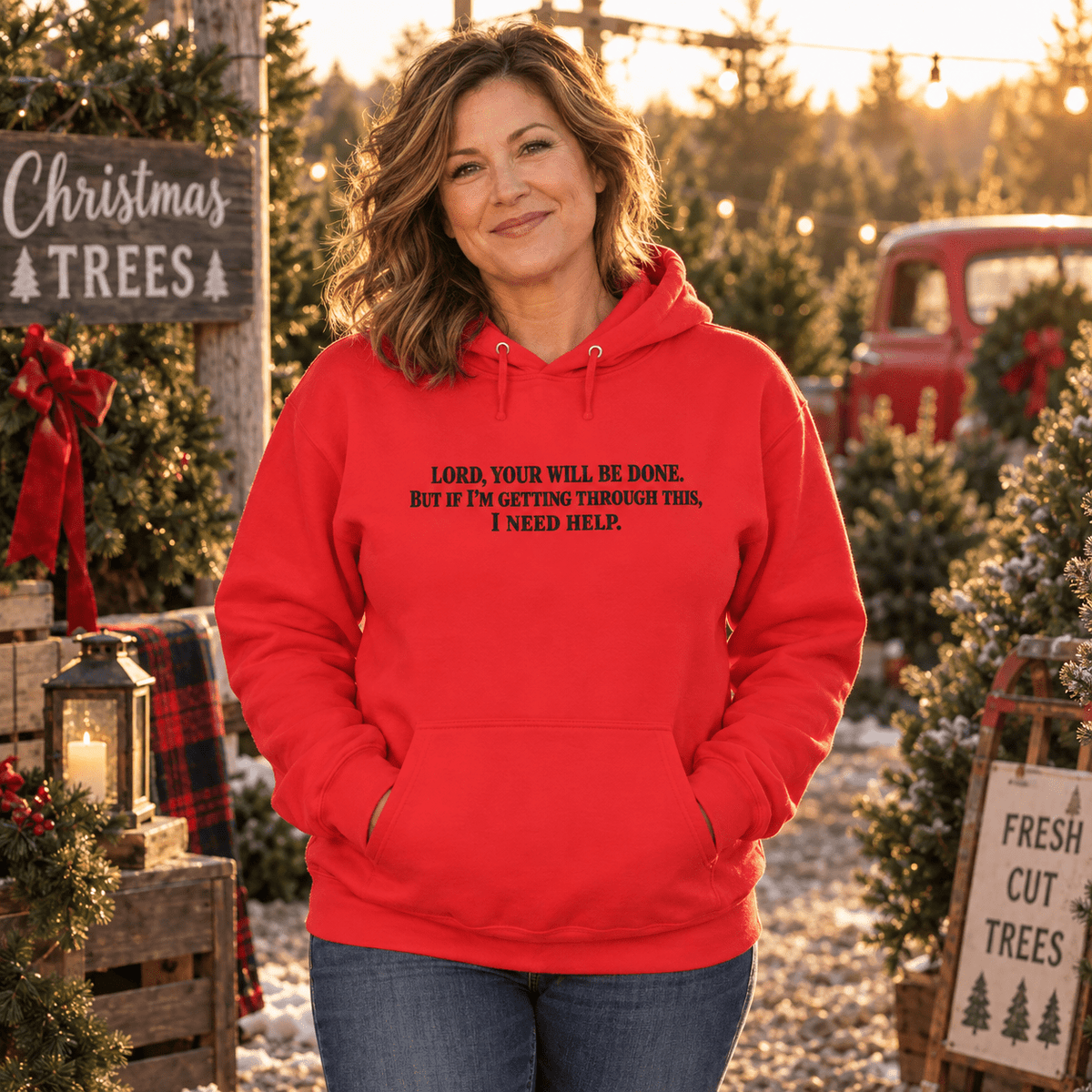 Woman wearing a Team Red Your Will Be Done: Descent CALLSIGN: BRAVO hoodie at a Christmas tree lot — front view