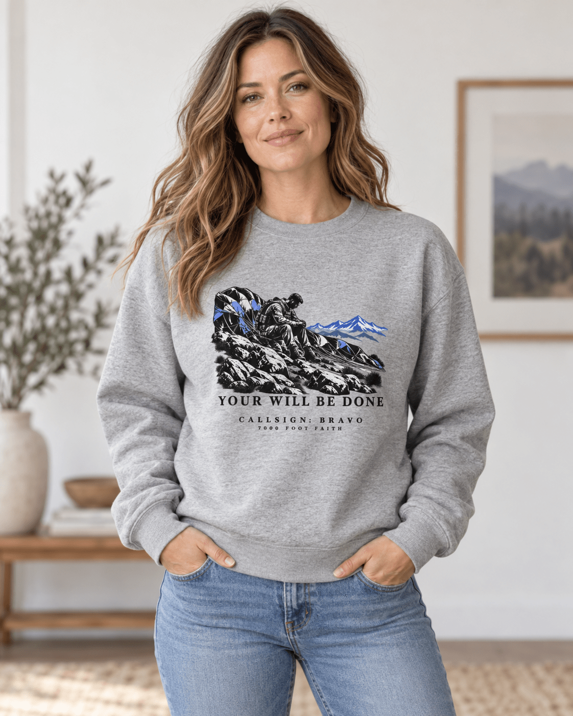 Woman wearing a Carbon Grey Your Will Be Done: The Aftermath CALLSIGN: BRAVO crewneck indoors — front view