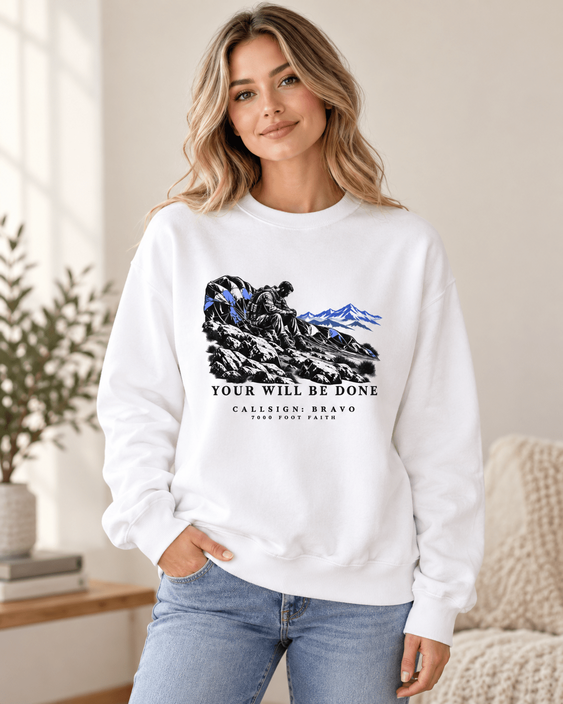 Woman wearing a White Your Will Be Done: The Aftermath CALLSIGN: BRAVO crewneck indoors — front view