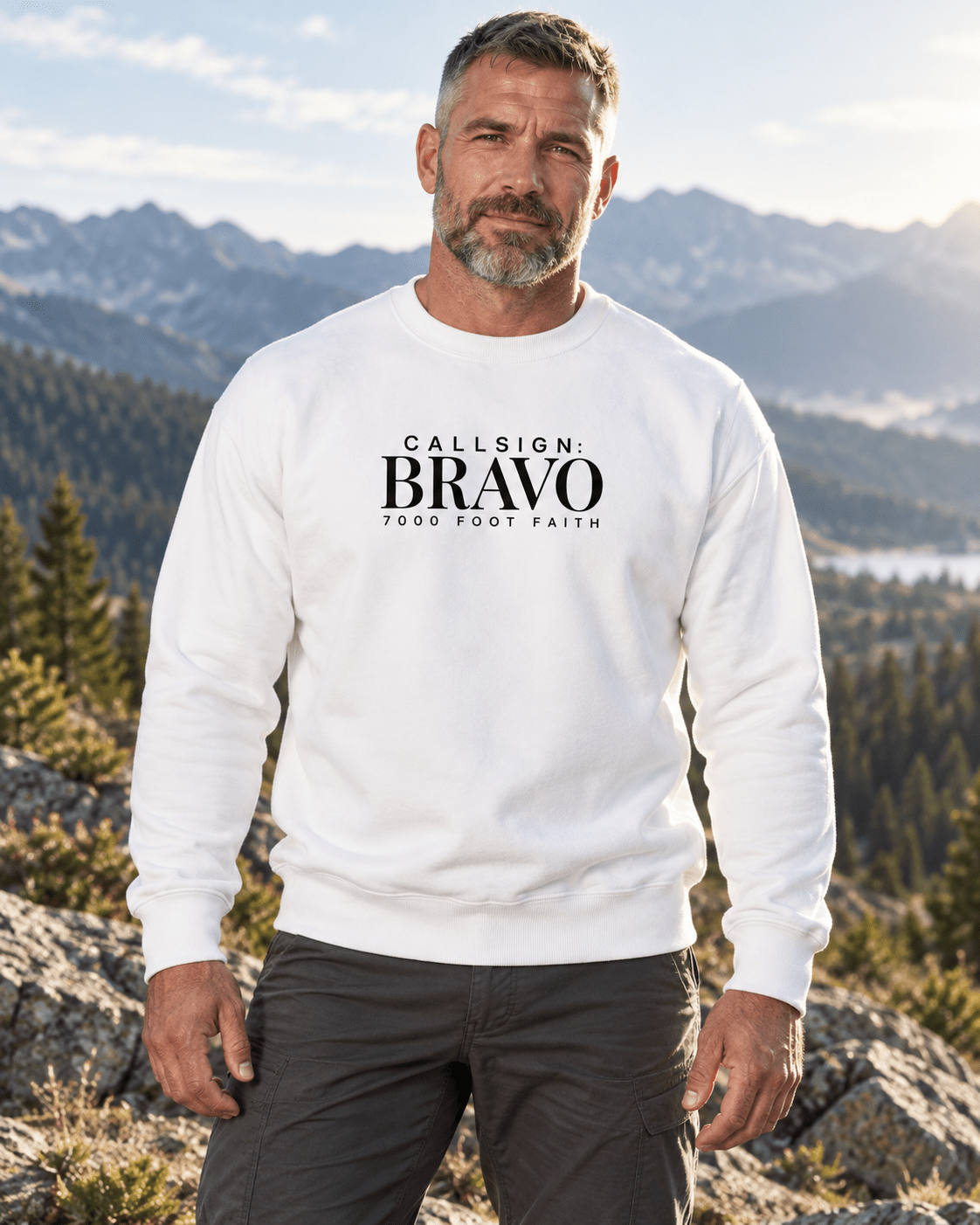 White Zagros Ridgeline CALLSIGN: BRAVO crewneck — male model in mountains, front view