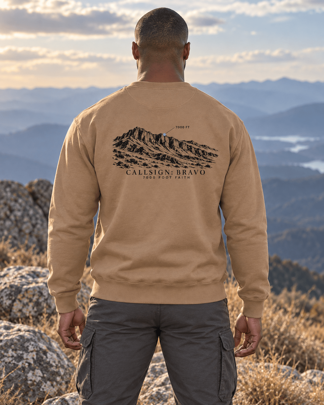 Latte Zagros Ridgeline CALLSIGN: BRAVO crewneck — male model in mountains, back view
