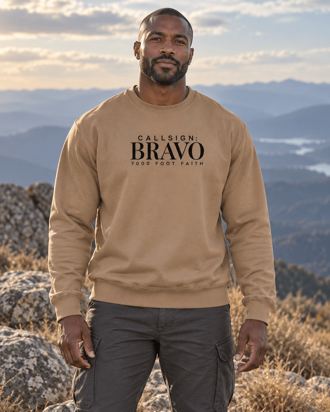 Latte Zagros Ridgeline CALLSIGN: BRAVO crewneck — male model in mountains, front view