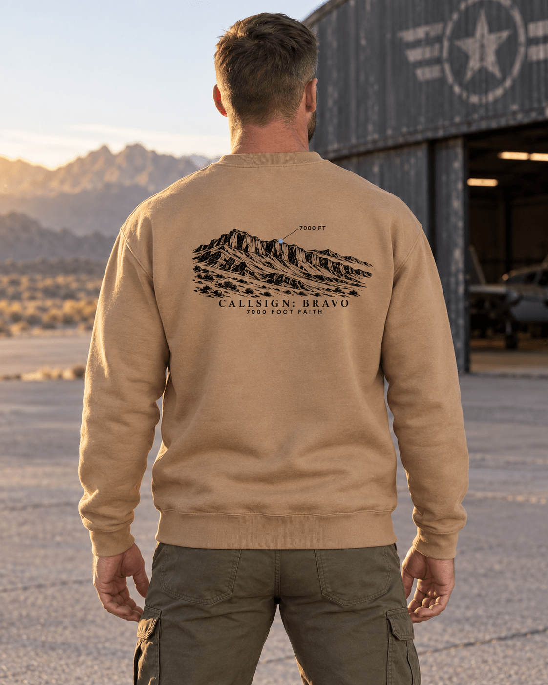 Latte Zagros Ridgeline CALLSIGN: BRAVO crewneck — male model outdoors, back view