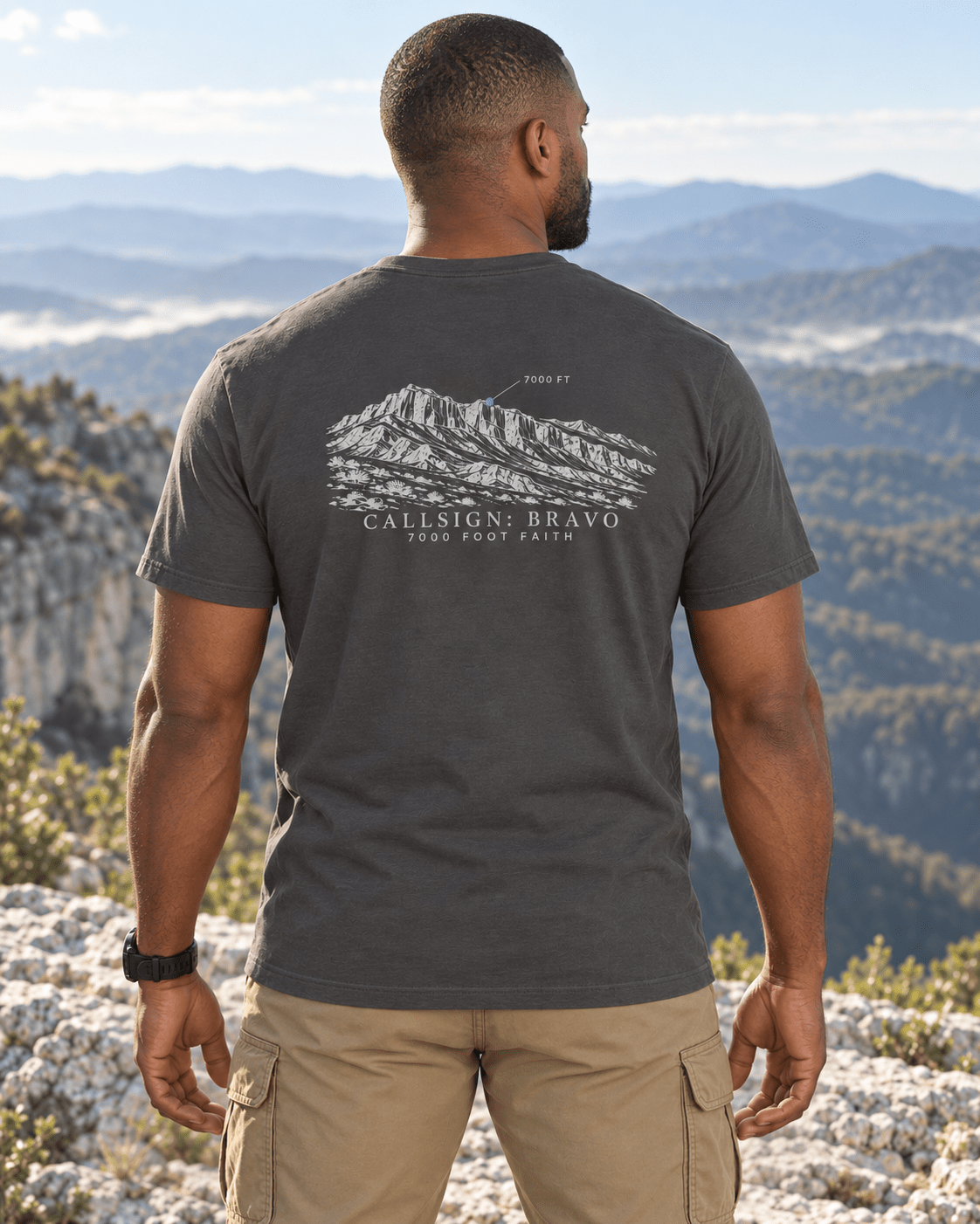 Asphalt Zagros Ridgeline Silver CALLSIGN: BRAVO tee — male model in mountains, back view