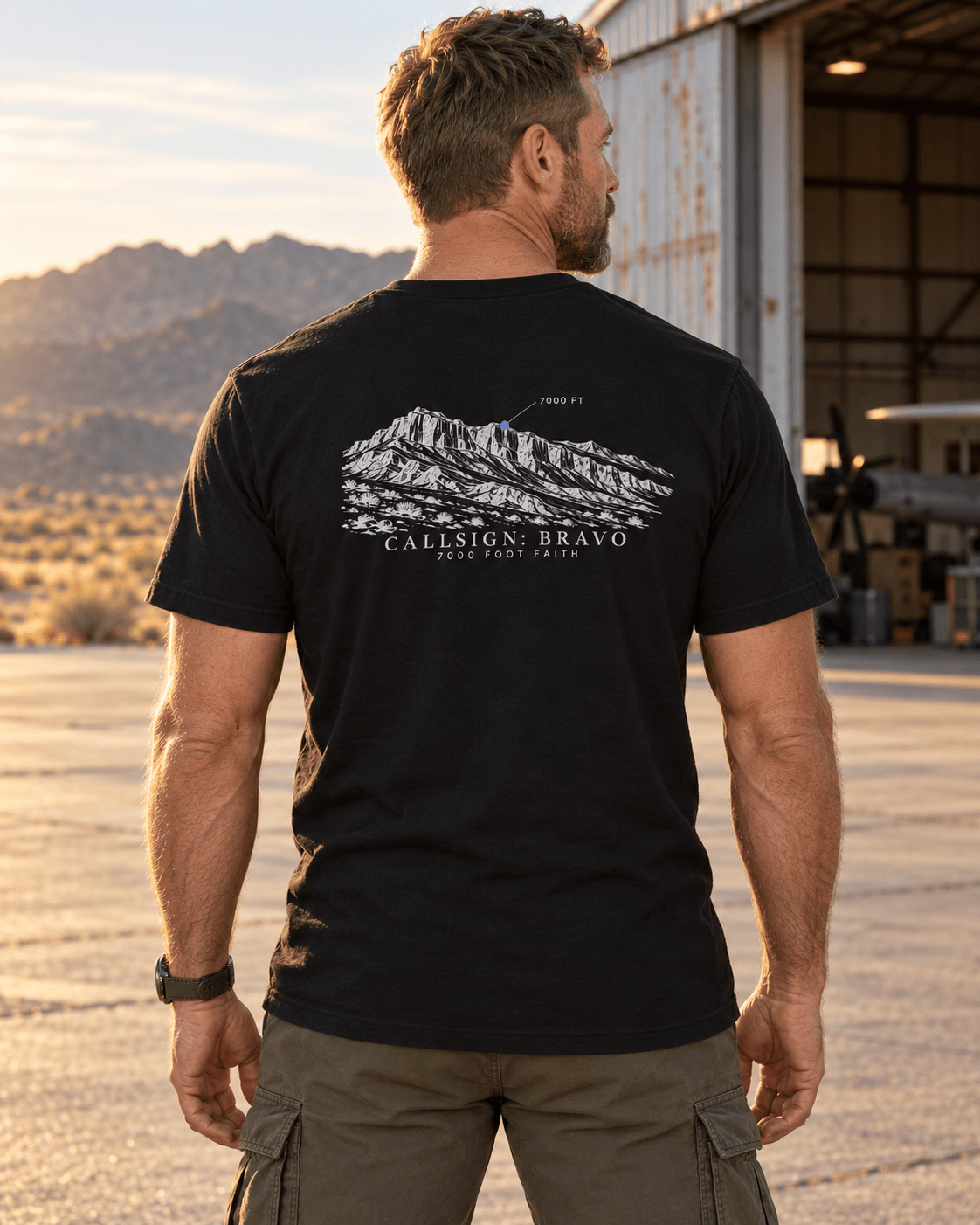 Black Zagros Ridgeline Silver CALLSIGN: BRAVO tee — male model outdoors, back view