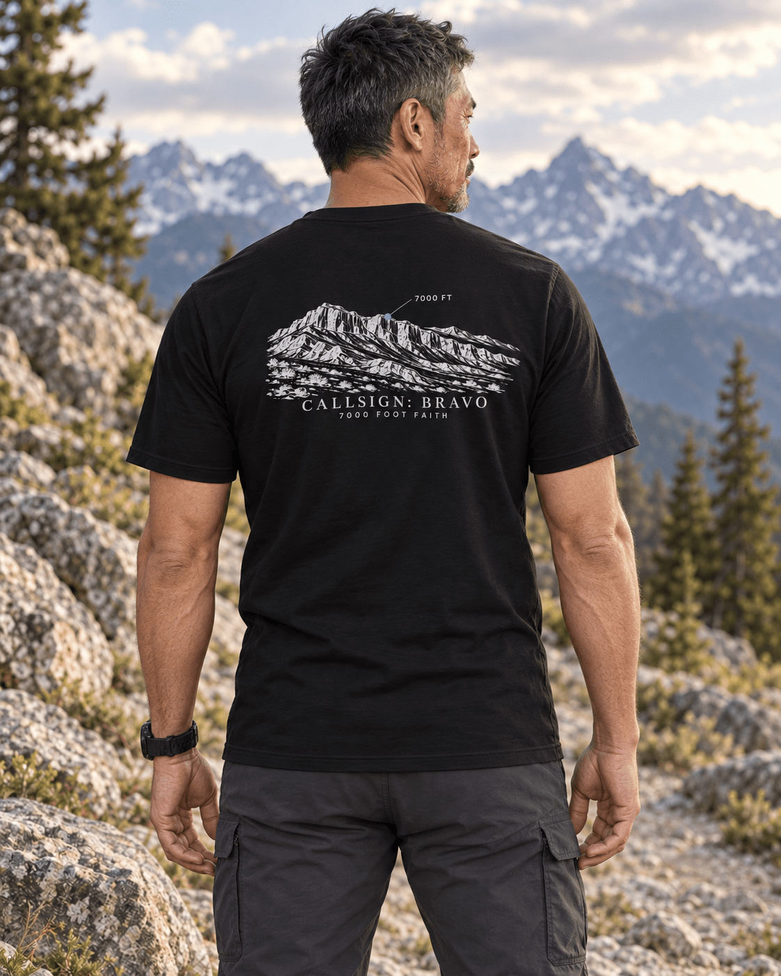 Black Zagros Ridgeline Silver CALLSIGN: BRAVO tee — male model in mountains, back view